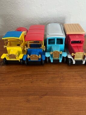 Vintage-Inspired Colorful Toy Truck Set - Yellow, Blue, Teal, Red